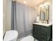 Bathroom featuring a modern vanity, shower with curtain, and stylish finishes at 2724 Parkwood Se Rd, Smyrna, GA 30080