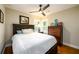 Well-lit bedroom with a hardwood floor and a wooden dresser at 2724 Parkwood Se Rd, Smyrna, GA 30080