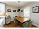 Cozy dining area with modern table, chairs, and natural light from the window at 2724 Parkwood Se Rd, Smyrna, GA 30080