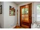 Mud room featuring a decorative mirror and wooden door with shuttered glass at 2724 Parkwood Se Rd, Smyrna, GA 30080
