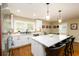 Bright kitchen features white cabinets, an island with marble countertop, and stainless steel appliances at 2724 Parkwood Se Rd, Smyrna, GA 30080