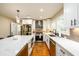 Modern kitchen with stainless steel appliances, a center island, and bright white cabinetry at 2724 Parkwood Se Rd, Smyrna, GA 30080