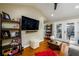 Open living room with modern decor, hardwood floors, and a glass door leading to backyard at 2724 Parkwood Se Rd, Smyrna, GA 30080