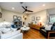 Cozy living room with modern furnishings, hardwood floors and a ceiling fan at 2724 Parkwood Se Rd, Smyrna, GA 30080