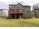 The house has a spacious backyard with a wooden deck that's perfect for outdoor dining and entertaining at 3880 Deer Run Dr, Cumming, GA 30028