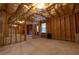 Spacious unfinished basement with exposed beams, offering potential for customization and expansion at 3880 Deer Run Dr, Cumming, GA 30028
