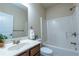 A bathroom featuring a shower-tub combination and a single vanity at 3880 Deer Run Dr, Cumming, GA 30028