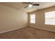 A bright bedroom featuring neutral walls, carpet flooring, and windows with natural light at 3880 Deer Run Dr, Cumming, GA 30028