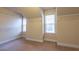 Spacious walk-in closet with carpeted floor, white walls and wire shelving for optimal storage solutions at 3880 Deer Run Dr, Cumming, GA 30028
