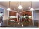 Modern kitchen with island, stainless appliances, granite counters and ample cabinet space at 3880 Deer Run Dr, Cumming, GA 30028
