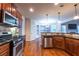 Charming eat-in kitchen features stainless appliances and stone backsplash at 3880 Deer Run Dr, Cumming, GA 30028