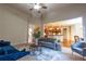 Open-concept living room with views of the kitchen and dining areas, plus stylish furniture at 3880 Deer Run Dr, Cumming, GA 30028