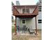 Backyard area with a deck above the patio and outdoor seating at 6125 Connell Rd, Atlanta, GA 30349