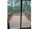 Spacious outdoor deck area with a view of the wooded backyard at 6125 Connell Rd, Atlanta, GA 30349