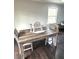Dining room featuring a stylish wooden table, comfortable seating, and elegant decor at 6125 Connell Rd, Atlanta, GA 30349