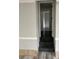 View of an interior hallway with dark wood-style flooring and neutral colored walls at 6125 Connell Rd, Atlanta, GA 30349