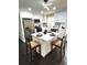 New kitchen features stainless steel appliances, a functional island, and dark hardwood flooring at 6125 Connell Rd, Atlanta, GA 30349