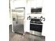 Kitchen features new stainless steel fridge, oven, stovetop, microwave and white cabinets at 6125 Connell Rd, Atlanta, GA 30349