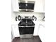 Kitchen showcases stainless steel oven, stove top, microwave and white subway tile backsplash at 6125 Connell Rd, Atlanta, GA 30349