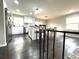 View of kitchen with stainless steel appliances, white cabinets, and hardwood floors at 6125 Connell Rd, Atlanta, GA 30349