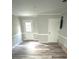 Spacious living room with durable wood-style floors, and lots of natural light at 6125 Connell Rd, Atlanta, GA 30349