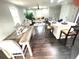 Open-concept living space featuring a dining area, kitchen island, and cozy living room at 6125 Connell Rd, Atlanta, GA 30349
