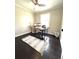 Bright office space with hardwood floors, ceiling fan, and natural light from a window at 6125 Connell Rd, Atlanta, GA 30349