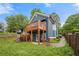 Inviting backyard featuring a raised deck, walkout basement and a stone fireplace, perfect for outdoor gatherings at 650 Ira Sw St, Atlanta, GA 30312