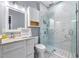 Modern bathroom with glass enclosed shower, marble tile, and a sleek vanity at 650 Ira Sw St, Atlanta, GA 30312