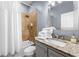 Bathroom featuring a shower-tub combo, granite vanity, and plenty of storage at 650 Ira Sw St, Atlanta, GA 30312