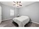 Bedroom featuring tiled floors, gray walls, ceiling fan, and minimal furniture at 650 Ira Sw St, Atlanta, GA 30312
