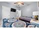 Inviting bedroom featuring twin beds, carpet, ceiling fan, and soothing paint at 650 Ira Sw St, Atlanta, GA 30312