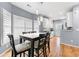 Bright dining area with large windows, stylish lighting, and hardwood flooring at 650 Ira Sw St, Atlanta, GA 30312