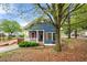 Inviting blue home featuring a cozy porch with wooden shutters at 650 Ira Sw St, Atlanta, GA 30312