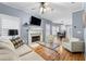 Comfortable living room features a fireplace, hardwood floors, and an open floor plan at 650 Ira Sw St, Atlanta, GA 30312