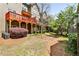 Private backyard area with multi-level decks and mature trees at 2250 W Village Junction Se Way, Smyrna, GA 30080