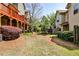 Private backyard area with multi-level decks and mature trees at 2250 W Village Junction Se Way, Smyrna, GA 30080