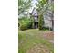 The backyard shows a private patio, lush landscaping and green lawn at 2250 W Village Junction Se Way, Smyrna, GA 30080