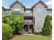 Back exterior of home showing deck and well maintained lawn and landscaping at 2250 W Village Junction Se Way, Smyrna, GA 30080