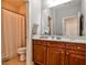 Bathroom with wood vanity with drawers, mirror, and shower with curtain at 2250 W Village Junction Se Way, Smyrna, GA 30080