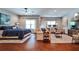 Spacious bedroom featuring a sitting area, ceiling fan, hardwood floors, and natural light at 2250 W Village Junction Se Way, Smyrna, GA 30080