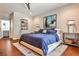 Bedroom features a large bed, side tables with lamps, and ensuite bathroom at 2250 W Village Junction Se Way, Smyrna, GA 30080