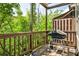 Cozy deck with a wooden privacy fence, trees and greenery surrounding the deck at 2250 W Village Junction Se Way, Smyrna, GA 30080