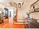 Inviting two-story foyer with hardwood floors, a staircase, and stylish decor at 2250 W Village Junction Se Way, Smyrna, GA 30080