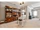 A home office featuring built-in shelving, a desk, a comfortable chair, and large windows at 2250 W Village Junction Se Way, Smyrna, GA 30080
