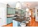 Lovely kitchen features an eat-in island, stainless appliances, and plenty of cabinet space at 2250 W Village Junction Se Way, Smyrna, GA 30080
