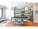 Bright kitchen with stainless appliances, eat-in island, hardwood floors, and stylish pendant lighting at 2250 W Village Junction Se Way, Smyrna, GA 30080