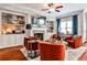 Comfortable living room with a fireplace, built-in shelving, and hardwood floors at 2250 W Village Junction Se Way, Smyrna, GA 30080