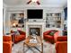 Cozy living room with a fireplace, custom shelving, and comfortable seating at 2250 W Village Junction Se Way, Smyrna, GA 30080