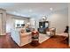 Spacious Living Room featuring hardwood flooring, ample seating, and natural lighting at 2250 W Village Junction Se Way, Smyrna, GA 30080